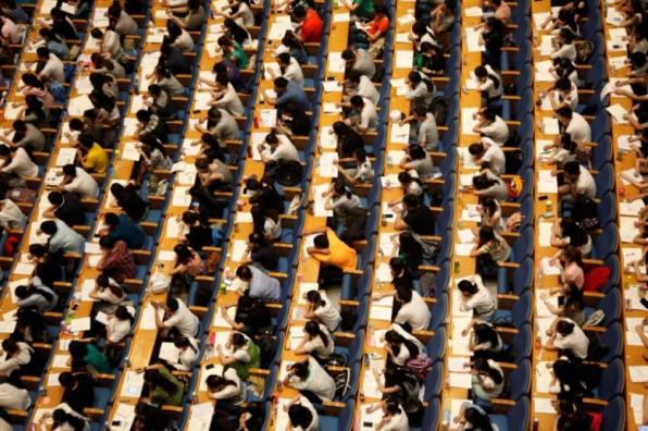 Students attend a lecture for the entrance exam for postgraduate studies at a hall in Jinan
